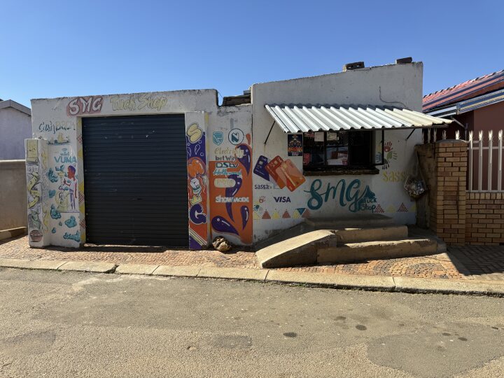 in front of a spaza shop